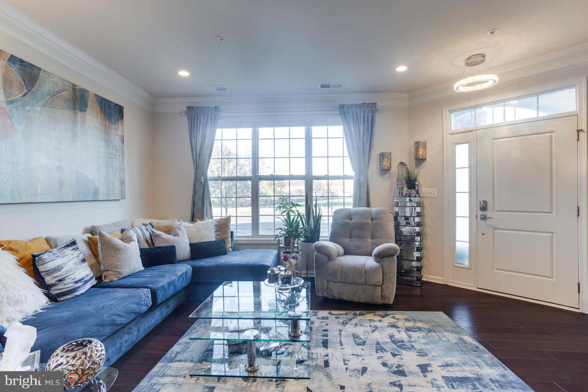 43048 Vernon Ridge Terrace Ashburn, VA 20148 - Photo 11 of 40 a living room with furniture and wooden floor