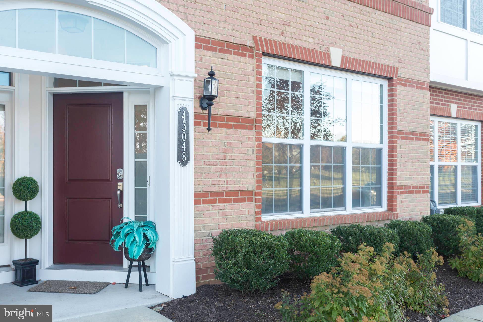43048 Vernon Ridge Terrace Ashburn, VA 20148 - Photo 2 of 40 a house with a potted plant