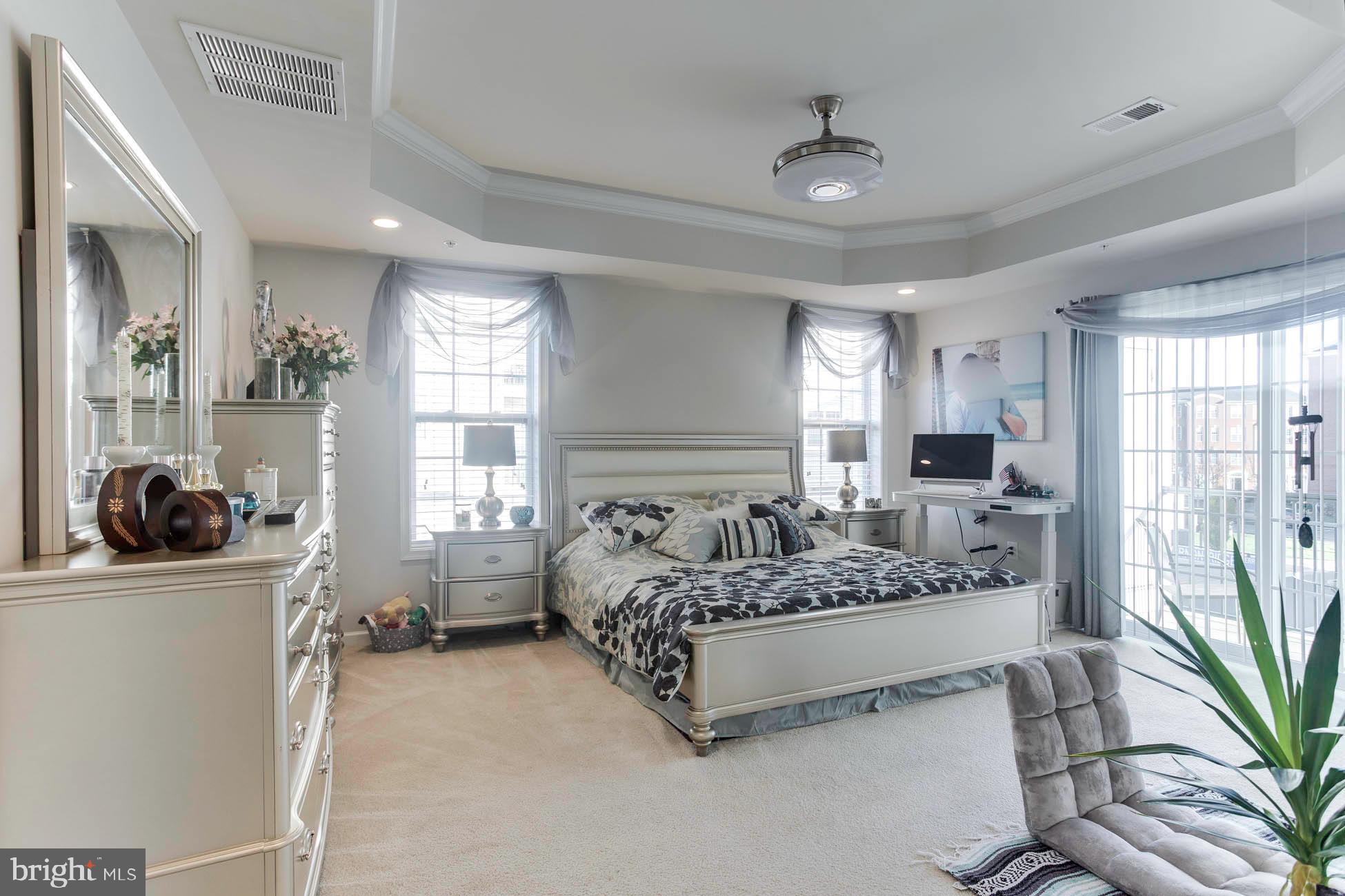 43048 Vernon Ridge Terrace Ashburn, VA 20148 - Photo 26 of 40 a spacious bedroom with a bed and a large window