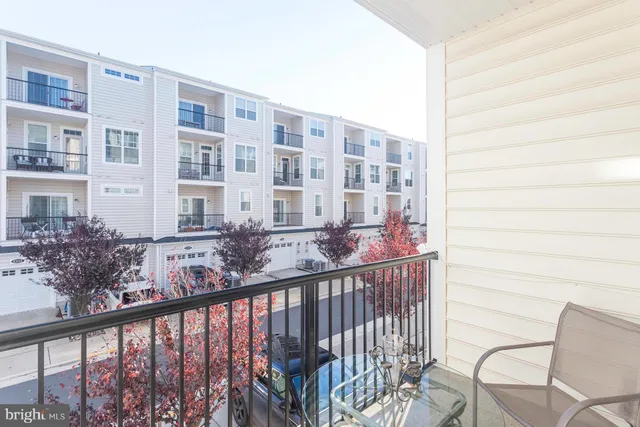 a view of a balcony with furniture