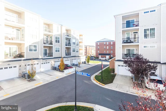 a view of a patio with dining table and chairs