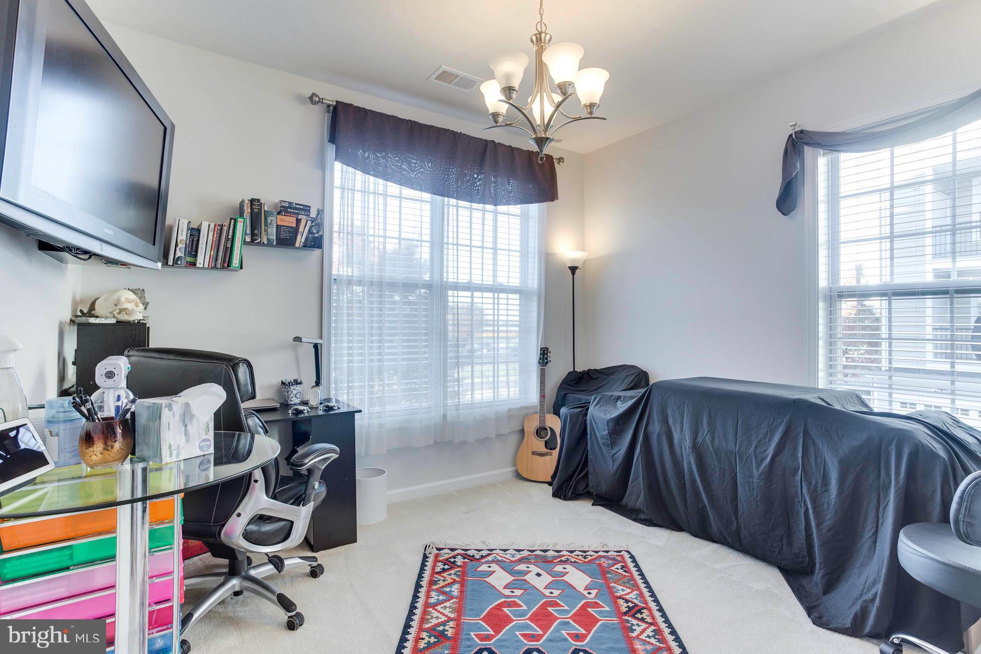 43048 Vernon Ridge Terrace Ashburn, VA 20148 - Photo 36 of 40 a bedroom with furniture and a window