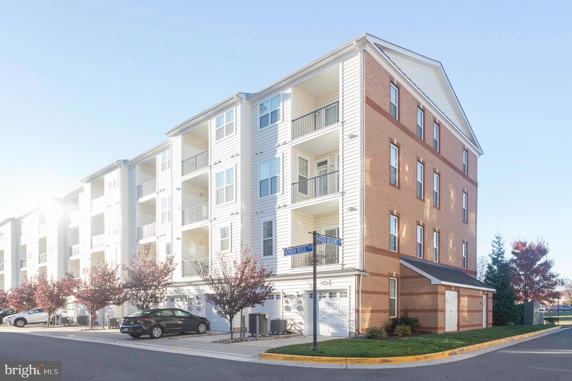 43048 Vernon Ridge Terrace Ashburn, VA 20148 - Photo 38 of 40 a front view of a multi story building