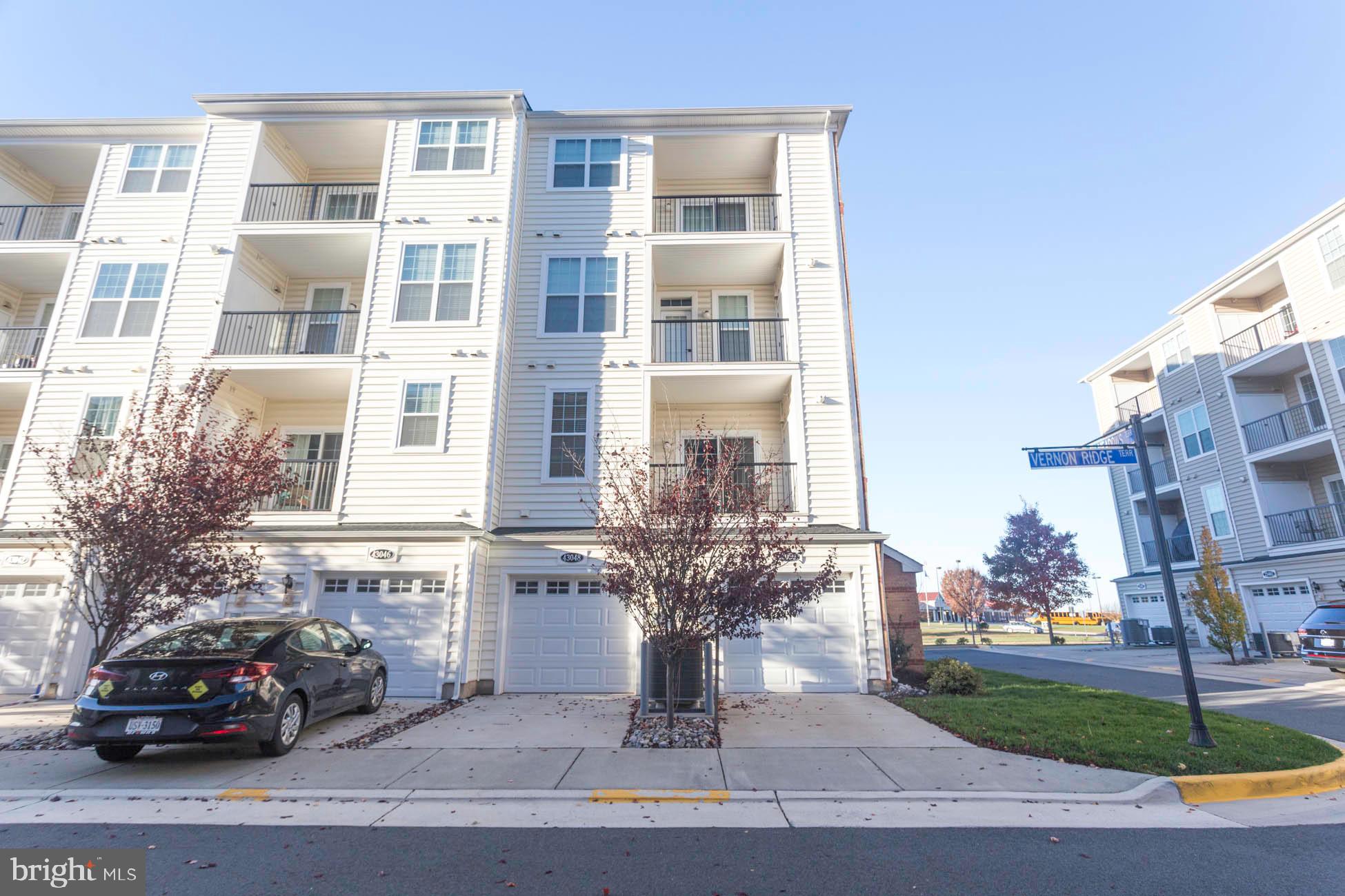 43048 Vernon Ridge Terrace Ashburn, VA 20148 - Photo 39 of 40 a car parked in front of a building
