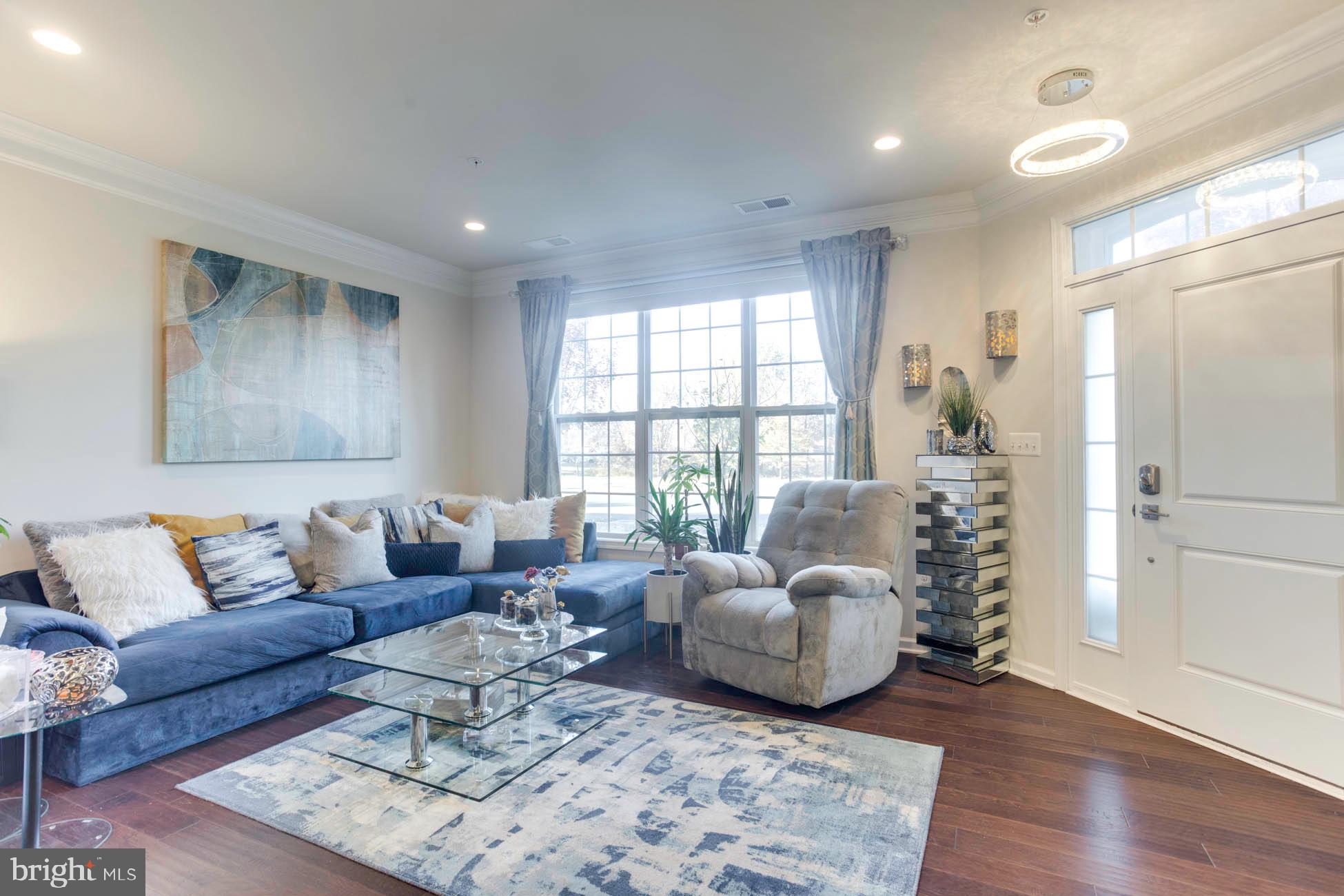43048 Vernon Ridge Terrace Ashburn, VA 20148 - Photo 7 of 40 a living room with furniture and wooden floor