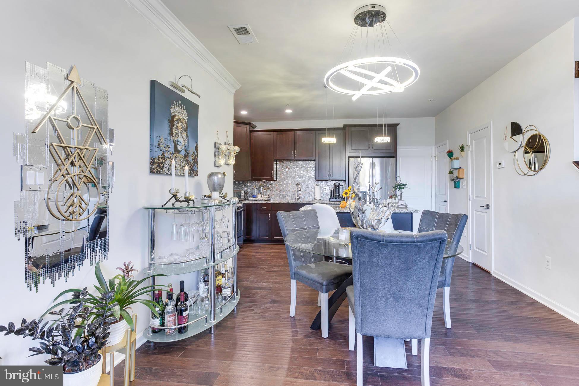 43048 Vernon Ridge Terrace Ashburn, VA 20148 - Photo 9 of 40 a dining room with furniture and wooden floor