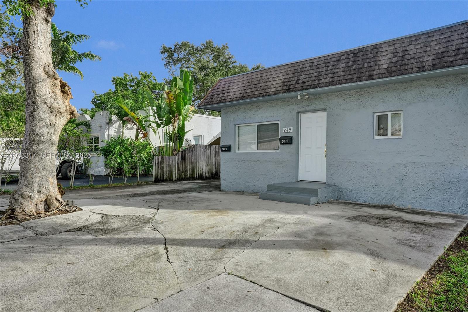 249 Southwest 4th Street, Unit 1 Dania Beach, FL 33004 - Photo 30 of 40 a view of a house with a yard