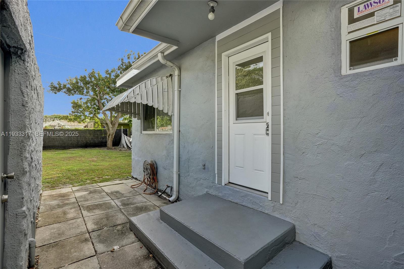 249 Southwest 4th Street, Unit 1 Dania Beach, FL 33004 - Photo 31 of 40 a view of backyard with barbeque grill and stairs