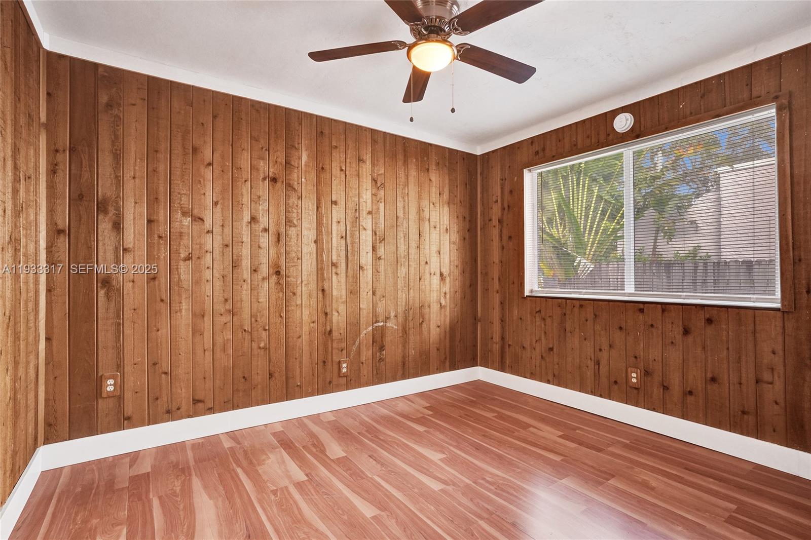 249 Southwest 4th Street, Unit 1 Dania Beach, FL 33004 - Photo 5 of 40 a view of a room with a window and a ceiling fan