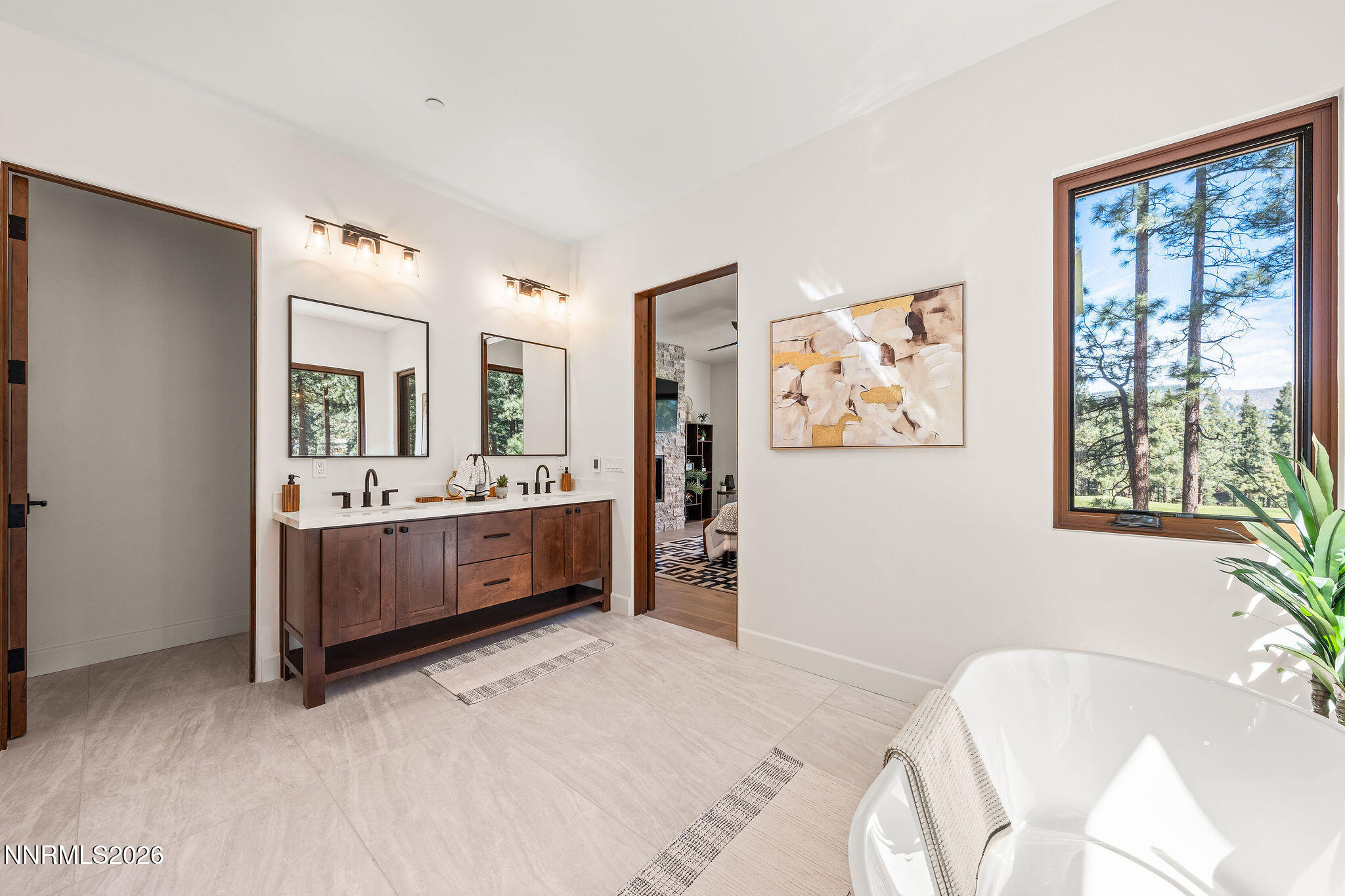 456 Headwaters Way Carson City, NV 89705 - Photo 13 of 40 a en suite bathroom with a double vanity sink and a mirror