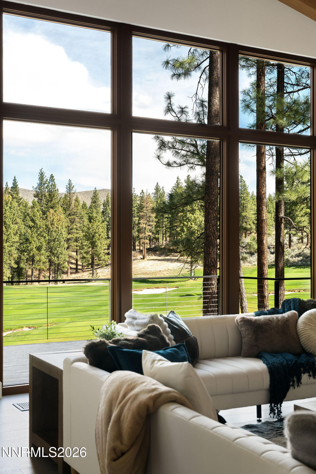 456 Headwaters Way Carson City, NV 89705 - Photo 2 of 40 a living room with furniture and a floor to ceiling window