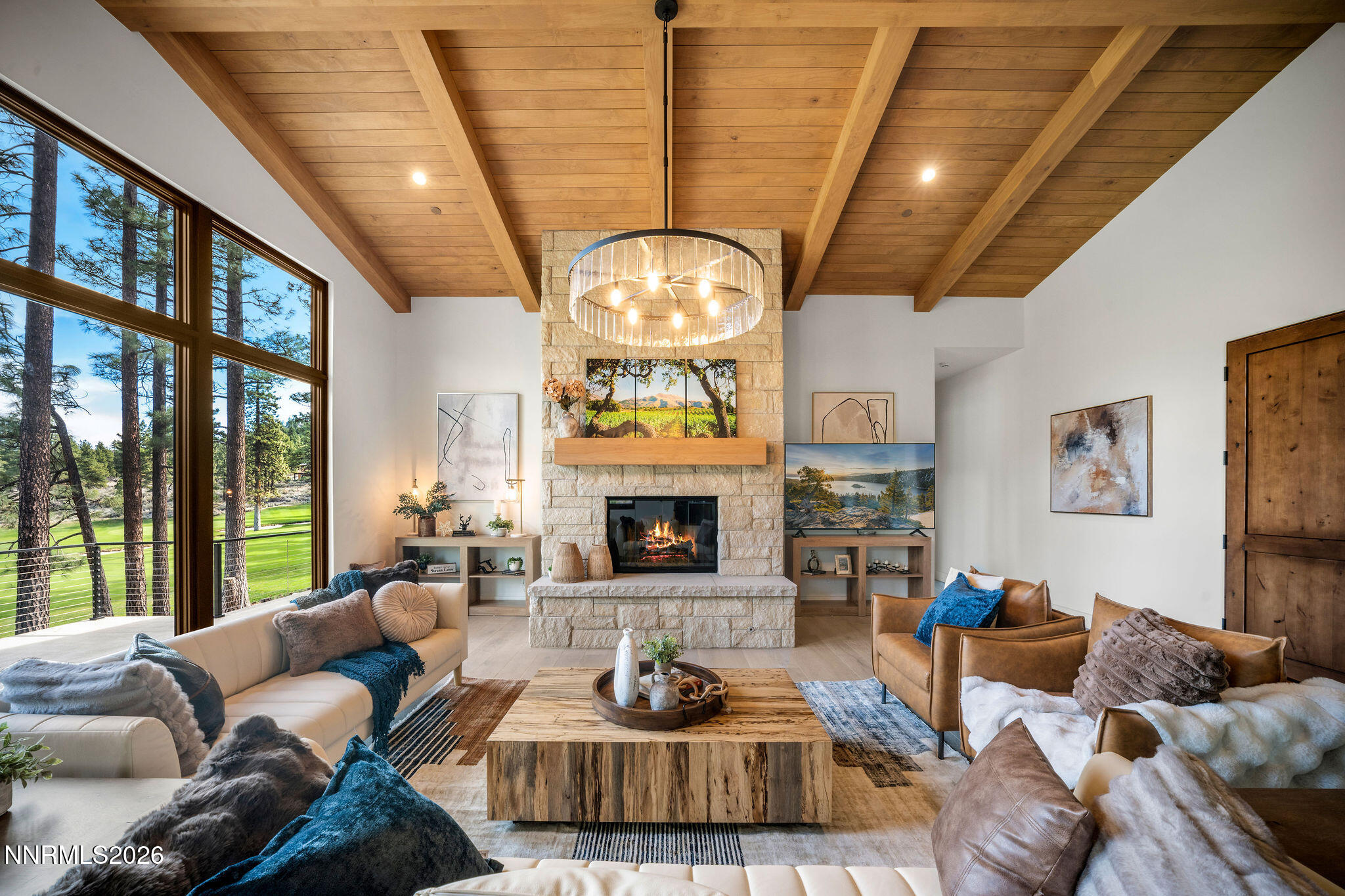 456 Headwaters Way Carson City, NV 89705 - Photo 3 of 40 a living room with furniture a fireplace and a large window