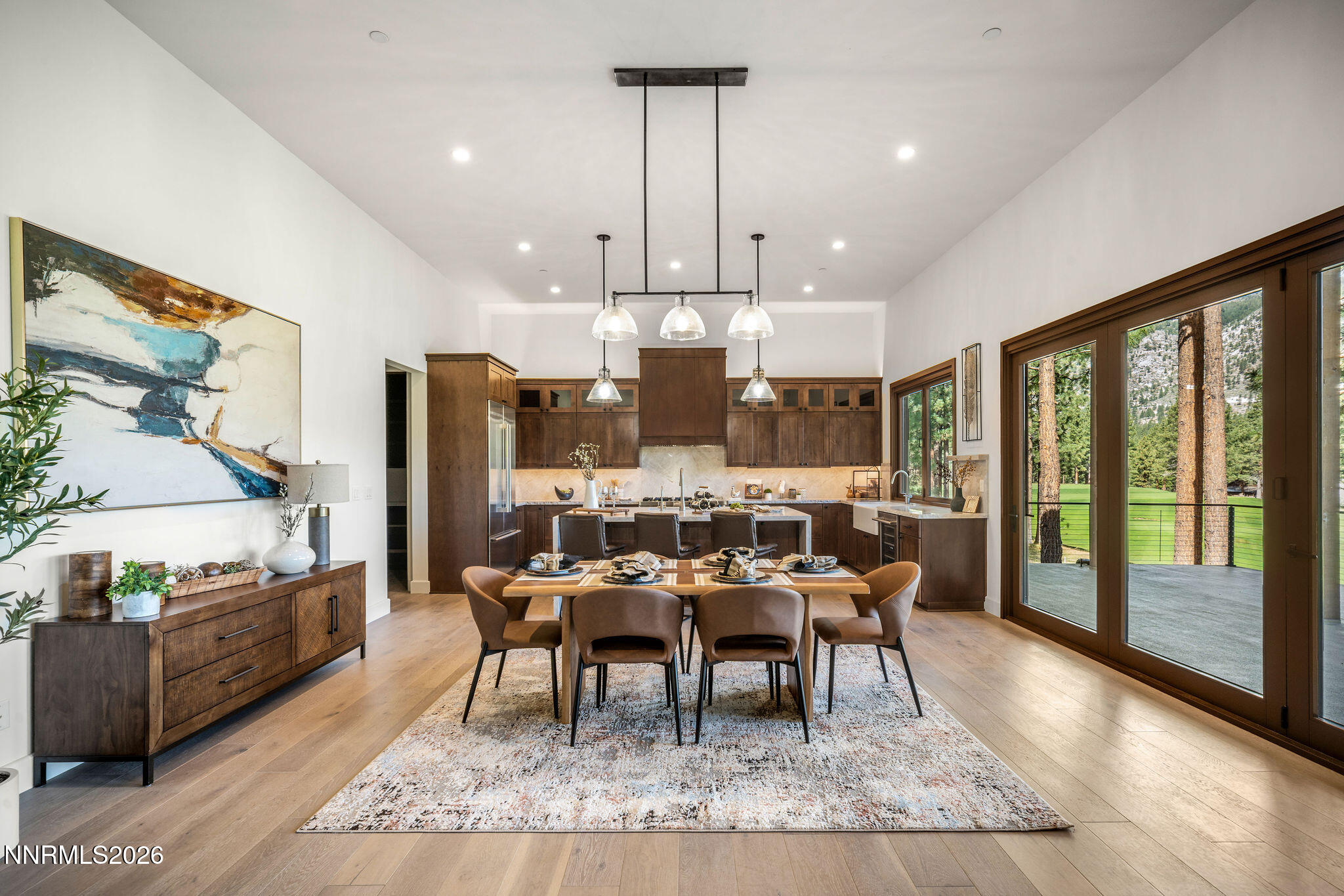456 Headwaters Way Carson City, NV 89705 - Photo 7 of 40 a dining room with furniture a chandelier and wooden floor