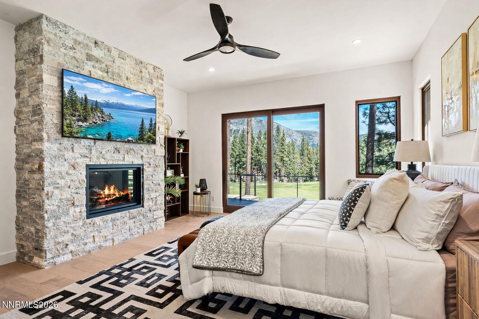 456 Headwaters Way Carson City, NV 89705 - Photo 10 of 40 a bedroom with a bed and a fireplace