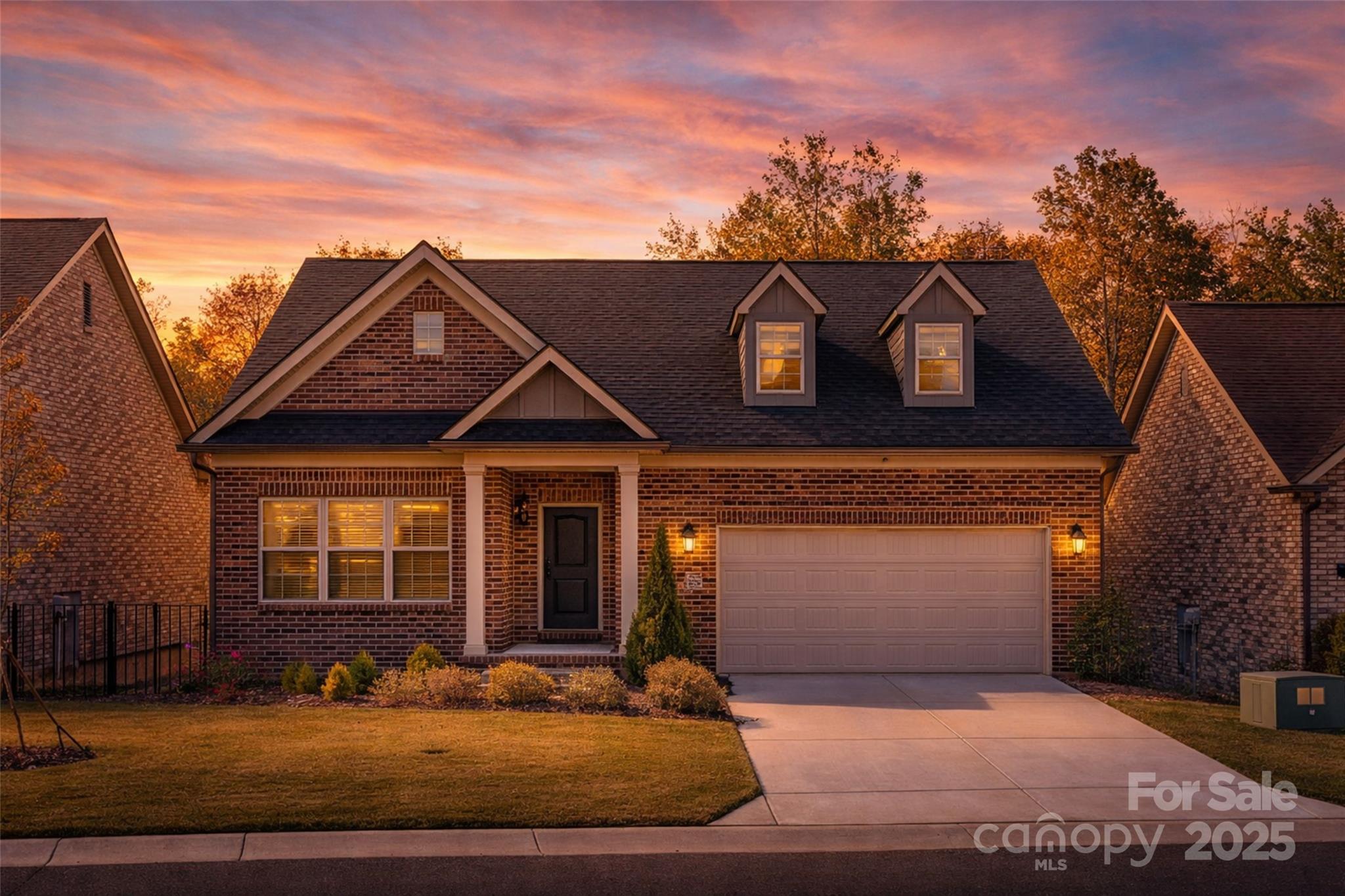 2031 New Style Way Tega Cay, SC 29708 - Photo 1 of 38 a front view of a house with a garden and mountain view