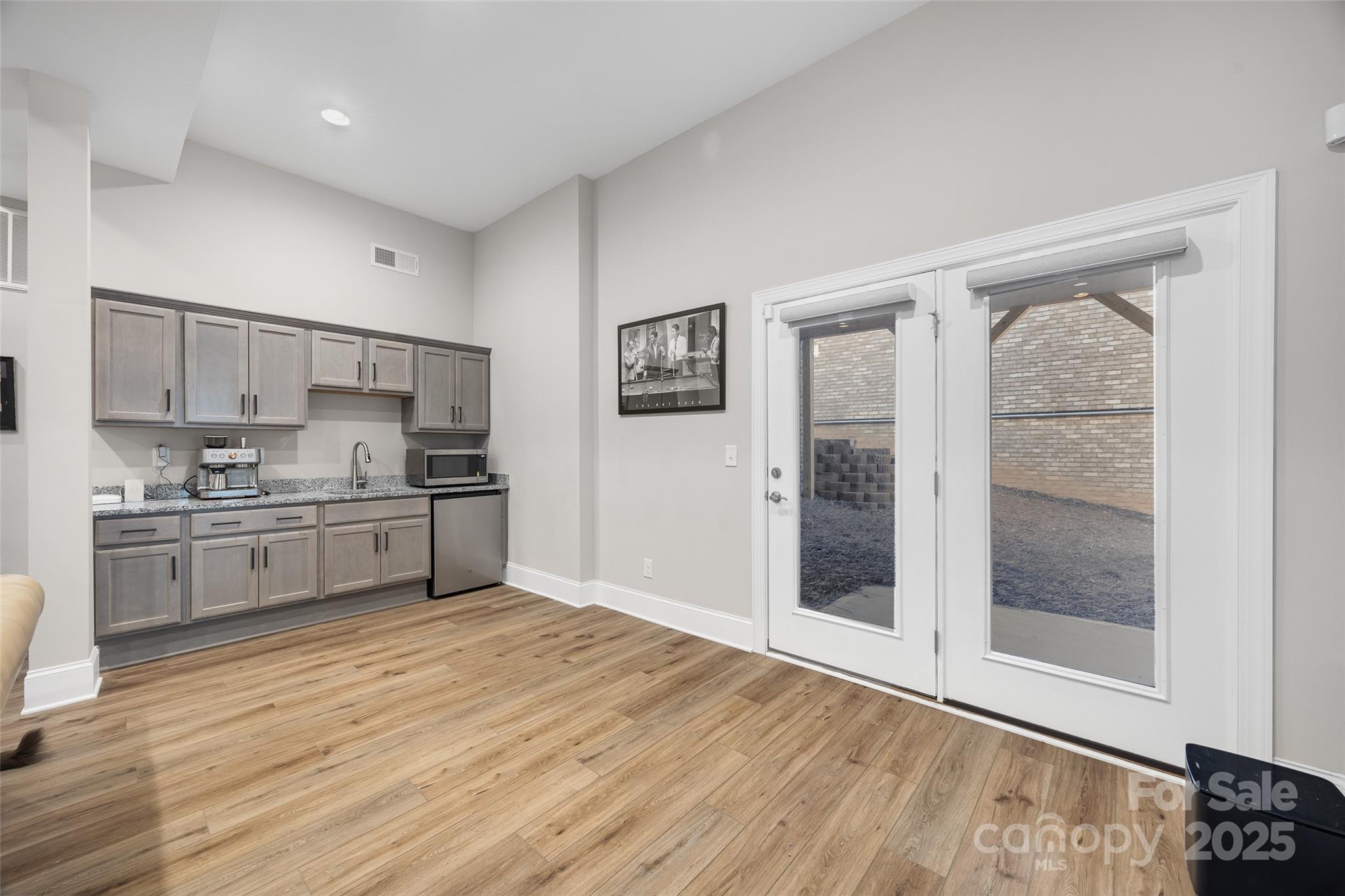 2031 New Style Way Tega Cay, SC 29708 - Photo 22 of 38 a kitchen with stainless steel appliances a refrigerator and a stove top oven