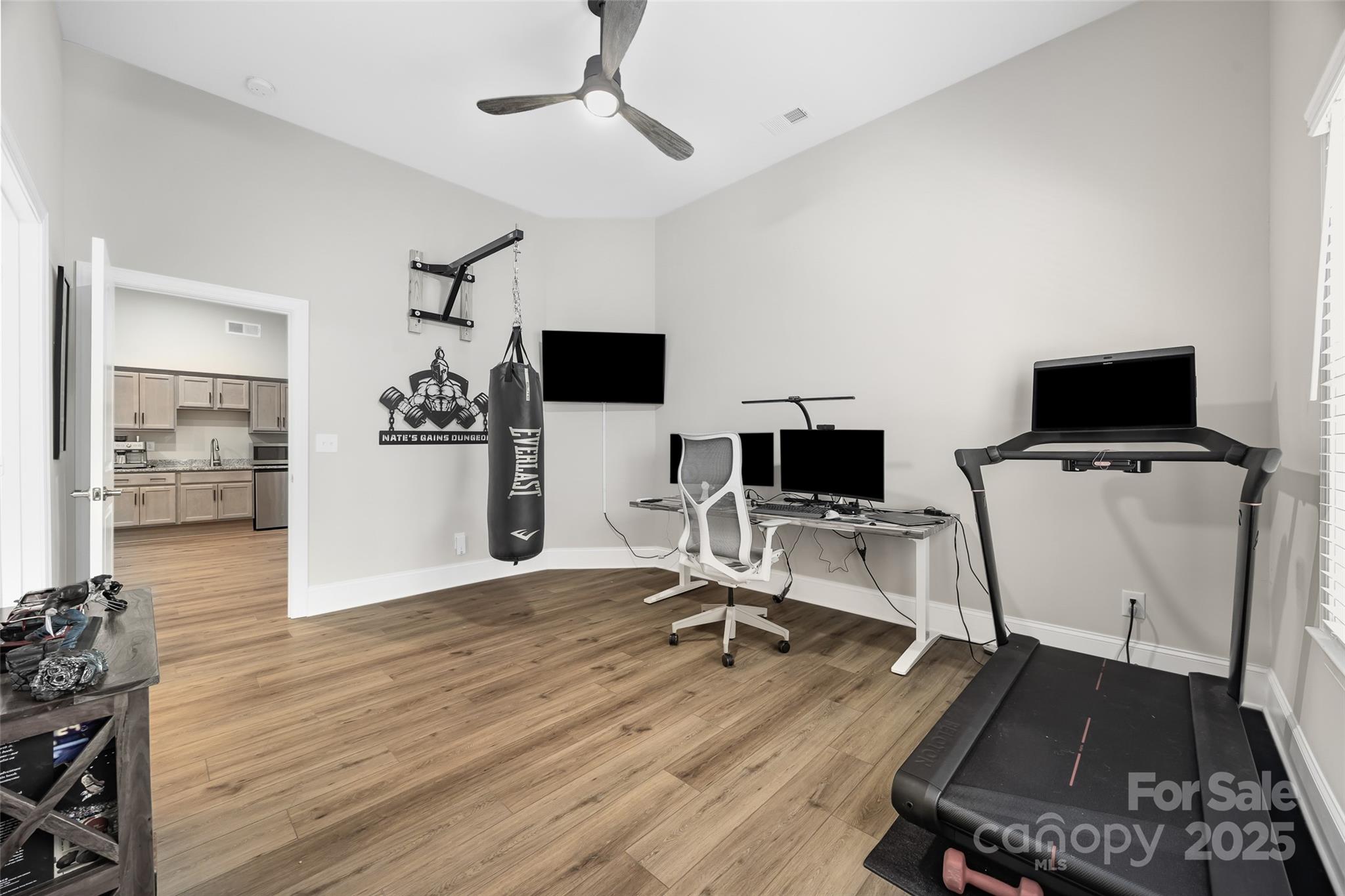 2031 New Style Way Tega Cay, SC 29708 - Photo 24 of 38 a view of a workspace with furniture and wooden floor