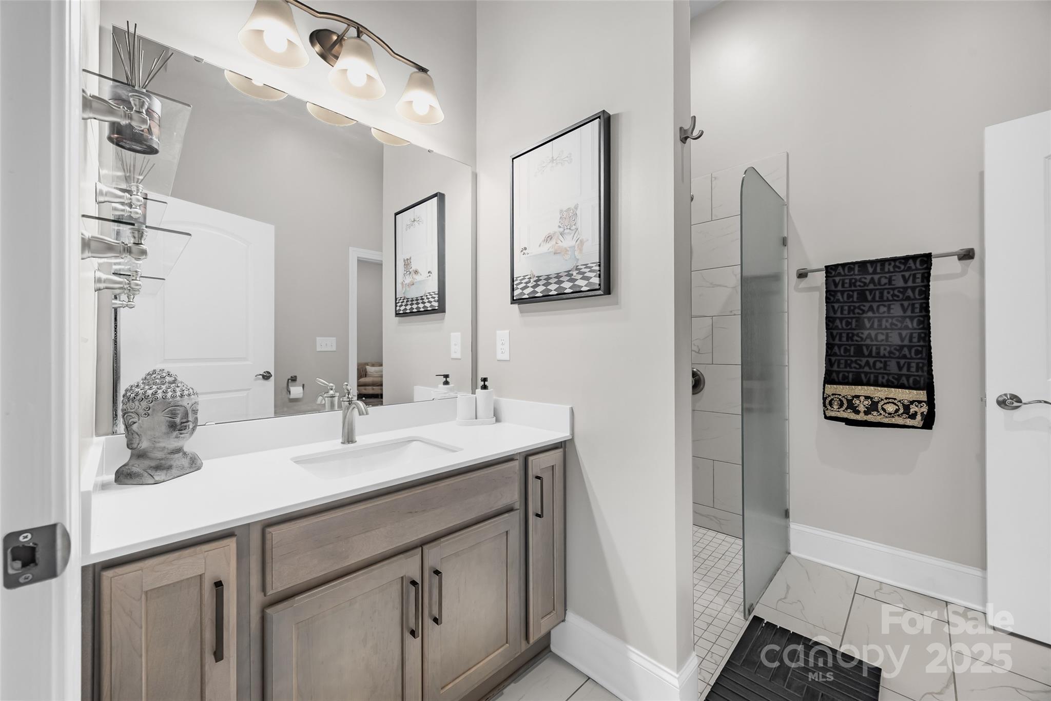 2031 New Style Way Tega Cay, SC 29708 - Photo 26 of 38 a bathroom with a sink and a mirror