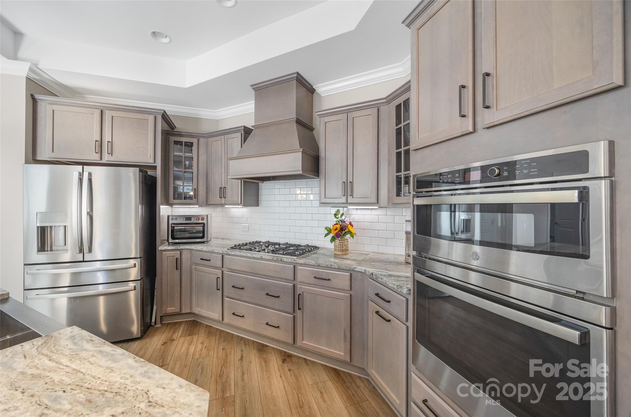 2031 New Style Way Tega Cay, SC 29708 - Photo 5 of 38 a kitchen with granite countertop a stainless steel appliances and cabinets