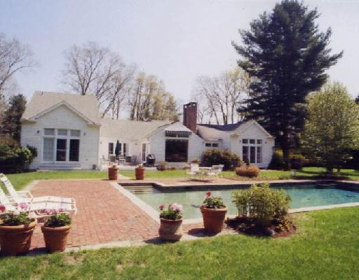 33 Cavalry Road Westport, CT 06880 - Photo 1 of 1 a front view of a house with swimming pool garden and patio
