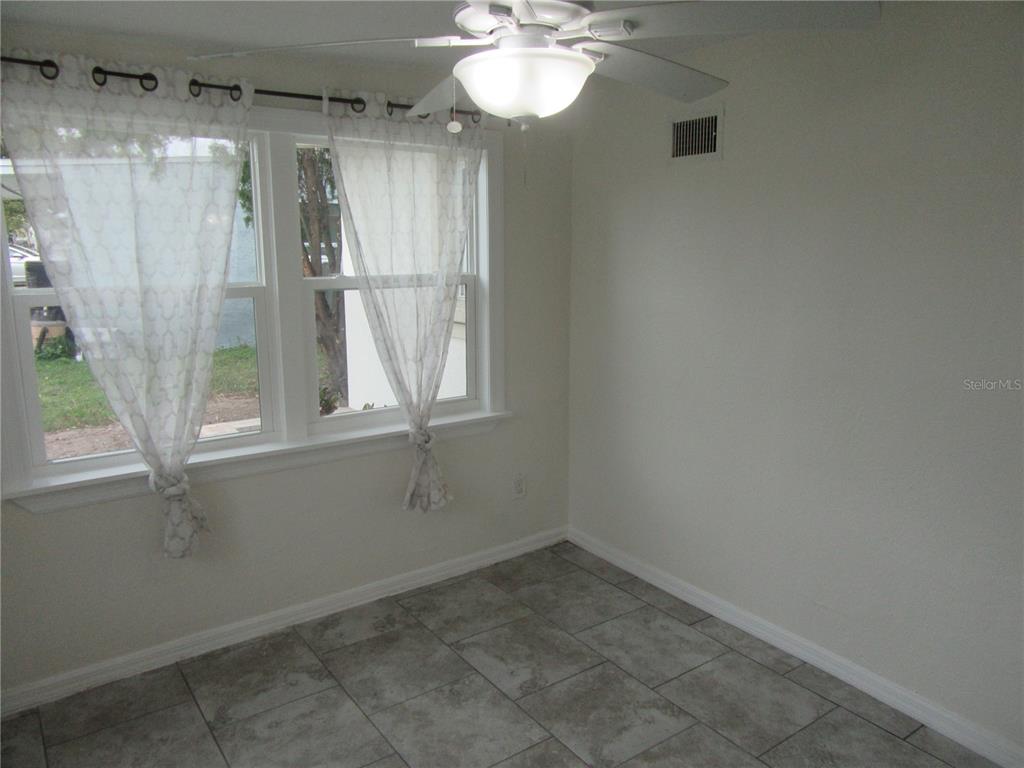 11913 104th Street Largo, FL 33773 - Photo 13 of 34 a view of a bathroom with a large window
