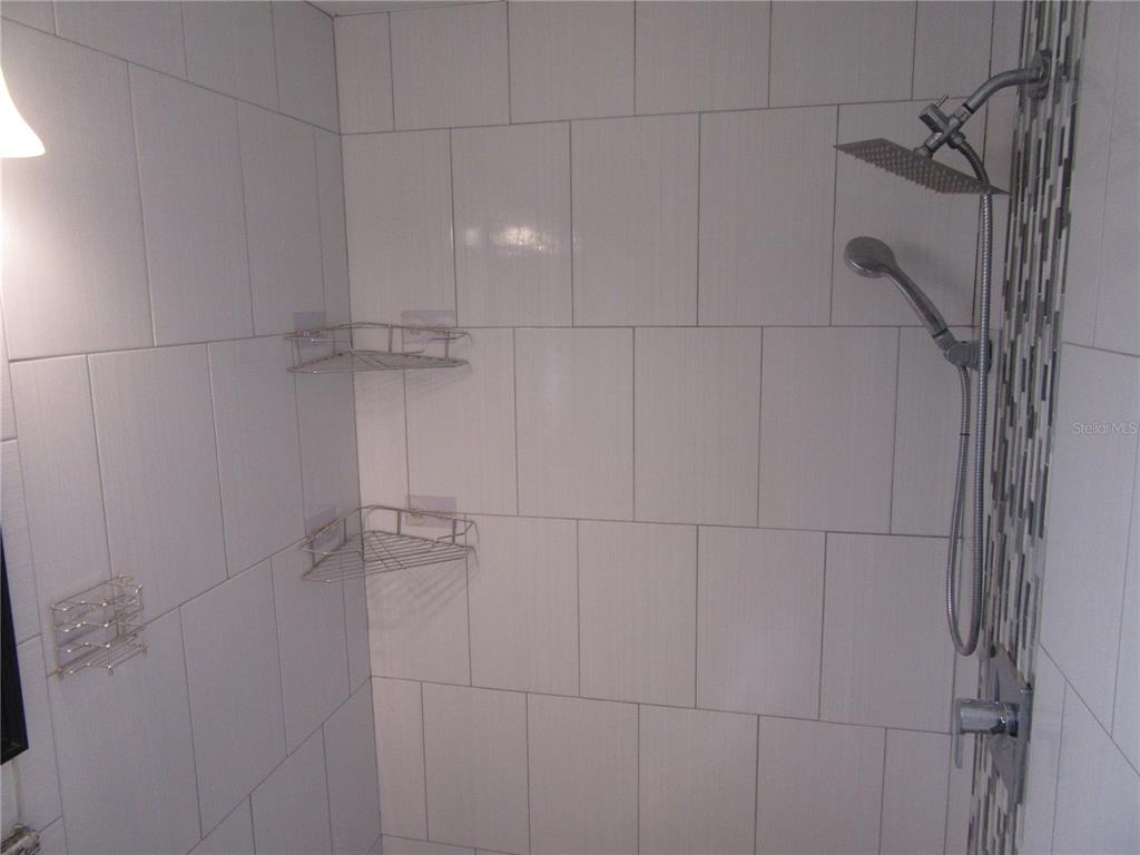 11913 104th Street Largo, FL 33773 - Photo 20 of 34 a bathroom with a shower