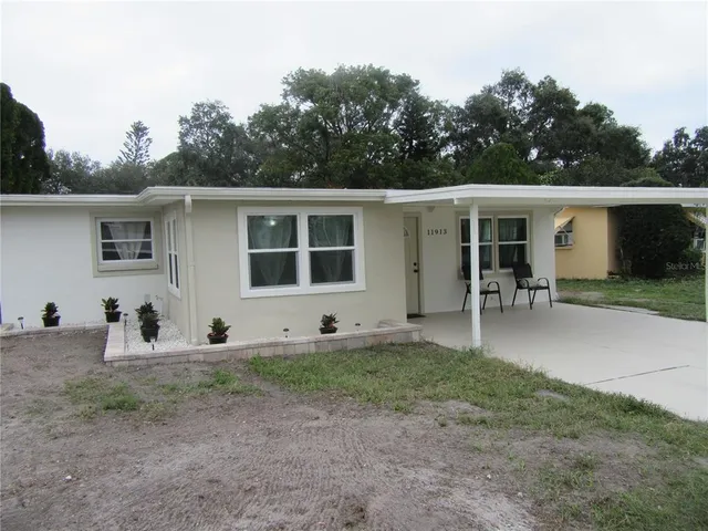 a view of a backyard with a sitting area