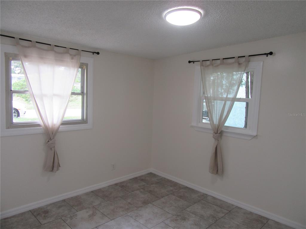 11913 104th Street Largo, FL 33773 - Photo 25 of 34 an empty room with a window