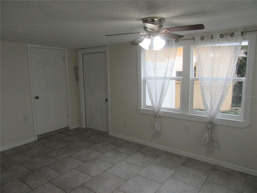 11913 104th Street Largo, FL 33773 - Photo 5 of 34 a view of an empty room with a window