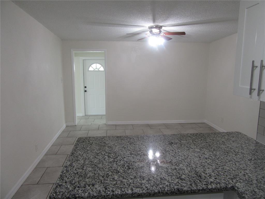 11913 104th Street Largo, FL 33773 - Photo 10 of 34 wooden floor in an empty room