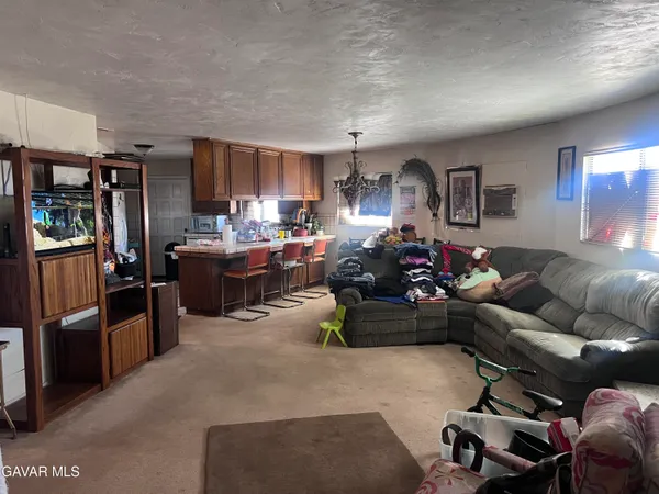 a kitchen with a sink cabinets and window