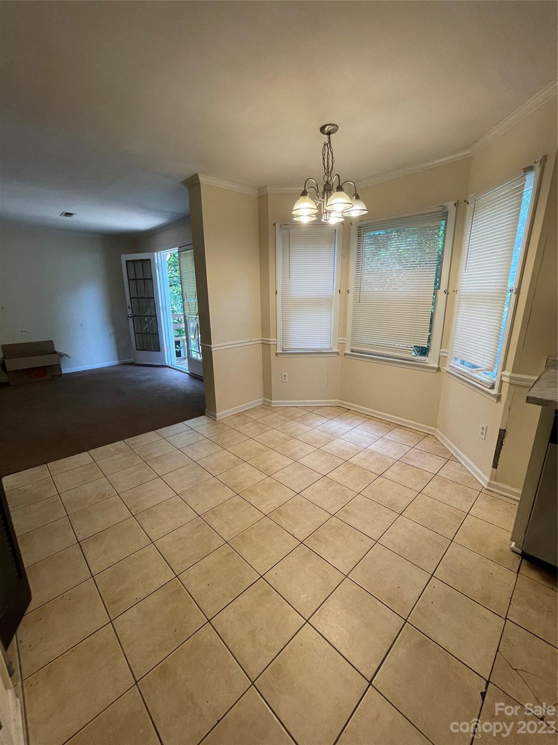 2819 Royal Ridge Lane Charlotte, NC 28212 - Photo 11 of 27 a view of a hallway with wooden floor and chandelier
