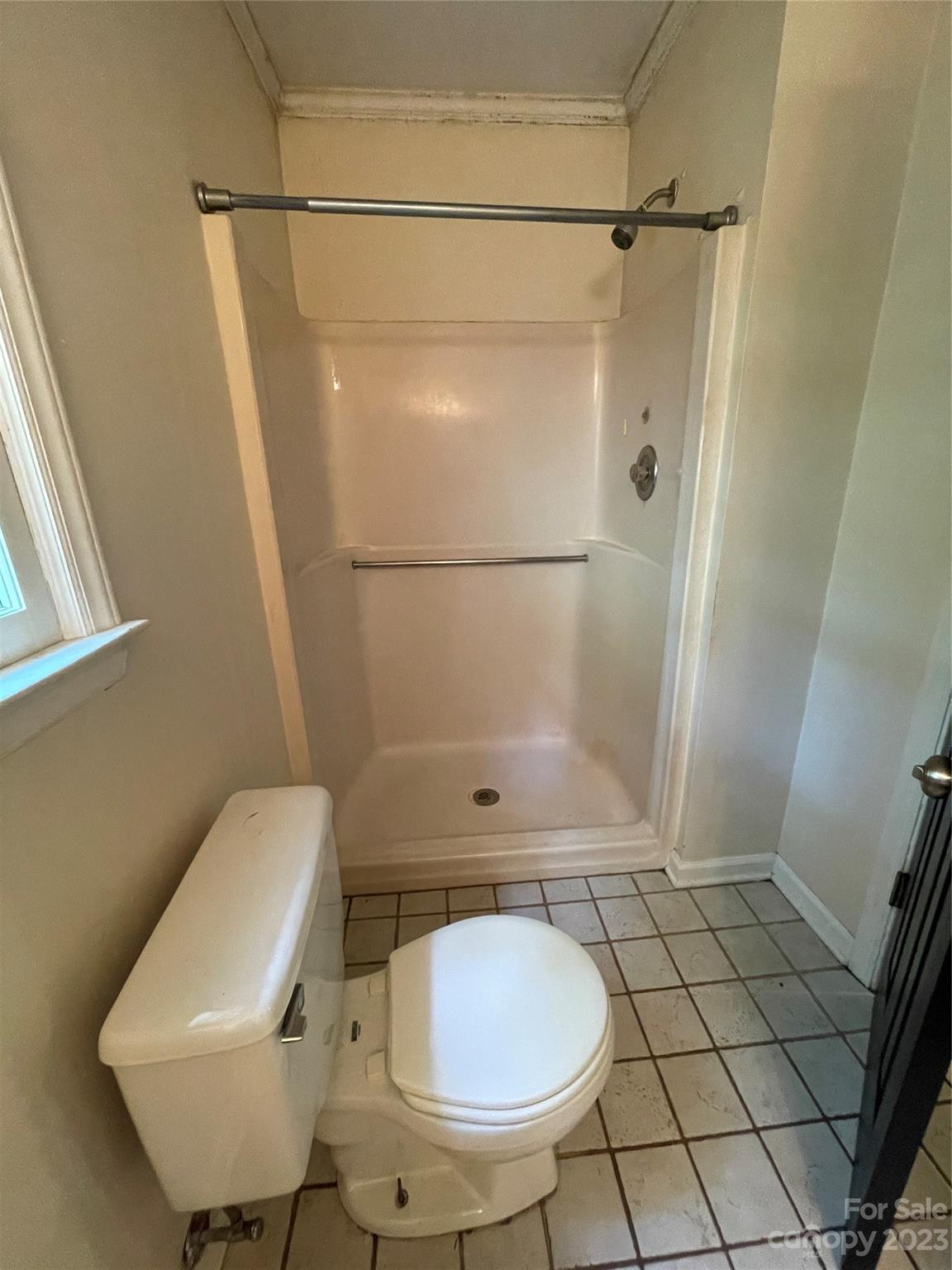 2819 Royal Ridge Lane Charlotte, NC 28212 - Photo 16 of 27 a bathroom with a toilet and a shower