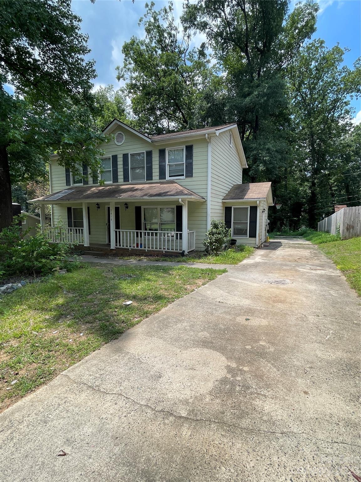 2819 Royal Ridge Lane Charlotte, NC 28212 - Photo 2 of 27 a front view of a house with yard and green space