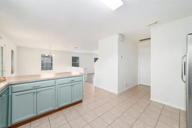 a spacious bathroom with a double vanity sink and mirror