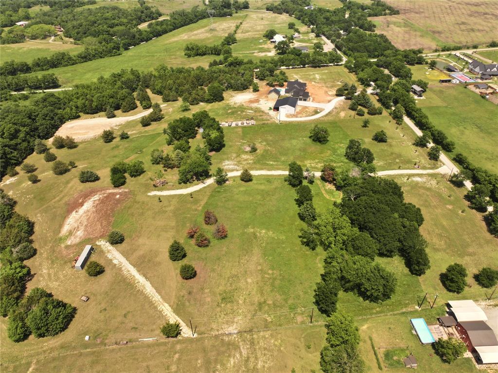 627 Homer Smith Road Van Alstyne, TX 75495 - Photo 8 of 36 an aerial view of residential houses with swimming pool