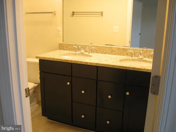 a bathroom with a sink and vanity