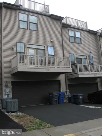 a front view of a house with many windows