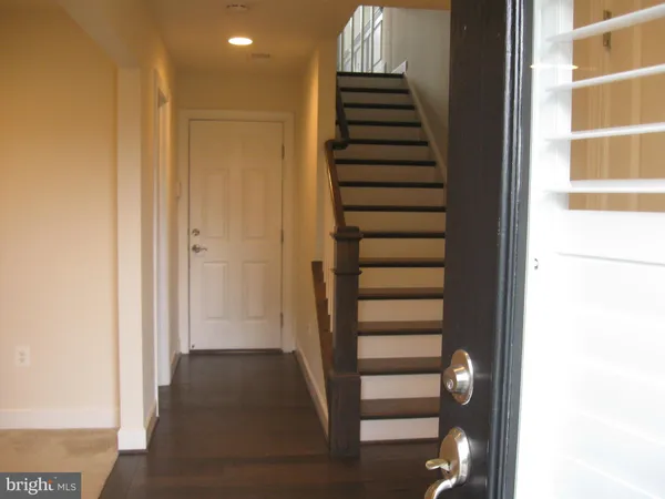 a view of a hallway with stairs