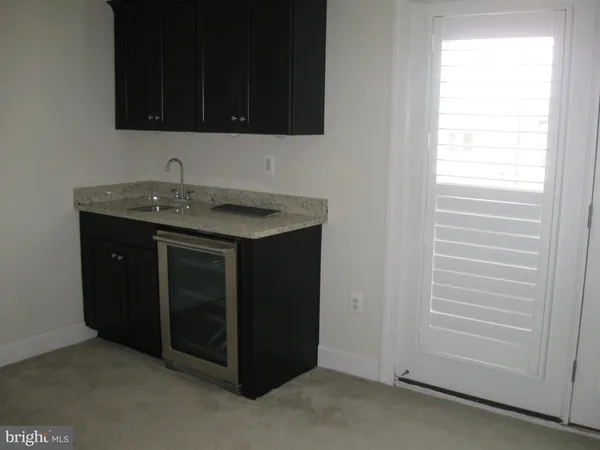 a kitchen with a sink and a window