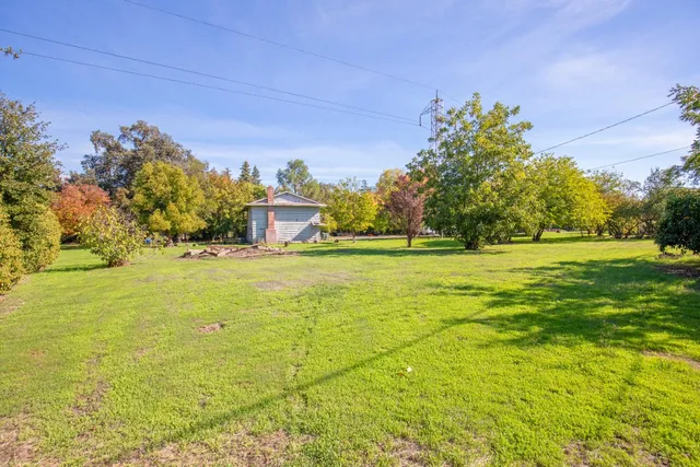 a view of a golf course with a house