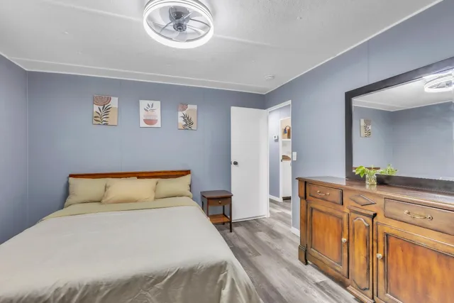 a bedroom with a bed and a cabinets