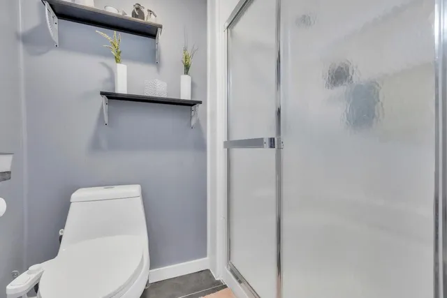 a bathroom with a toilet and a sink