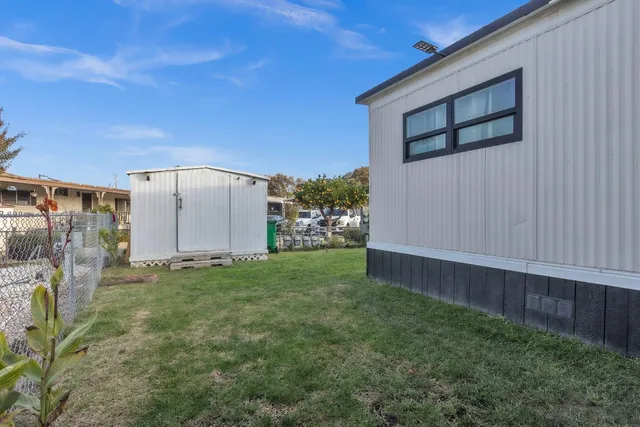 a view of a backyard of the house