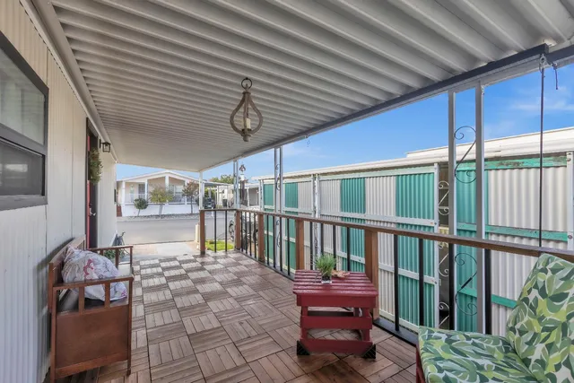 a view of balcony with furniture