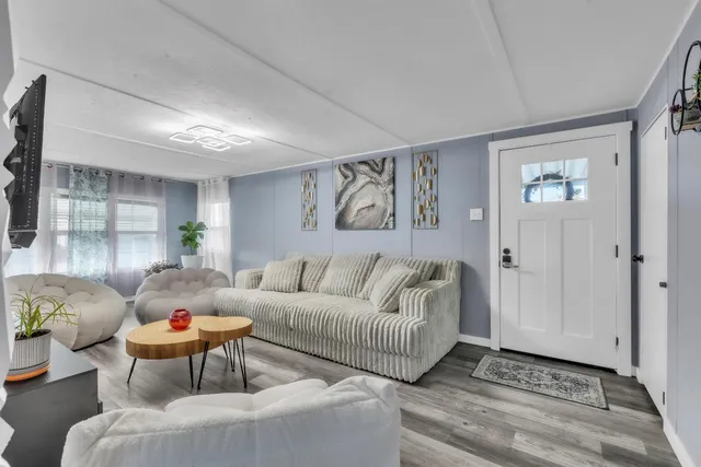 a living room with furniture and window