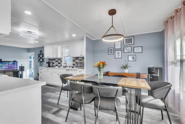 a dining room with a table and chairs