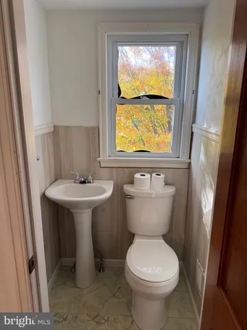 a view of outdoor space with wooden floor and windows