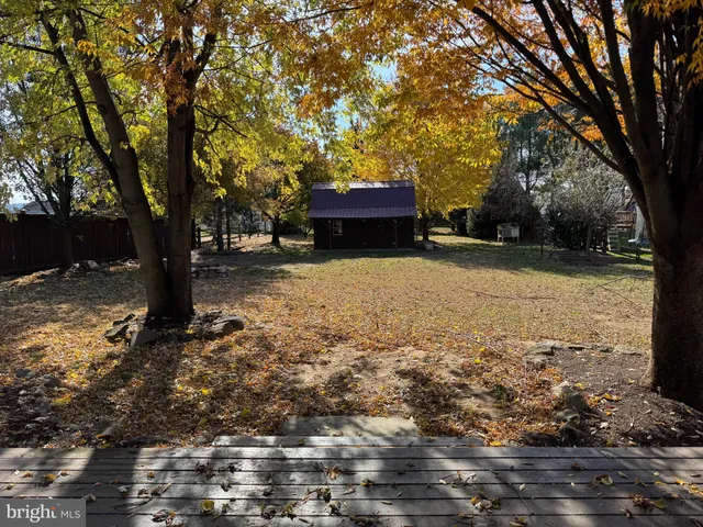 a view of house with snow on the road