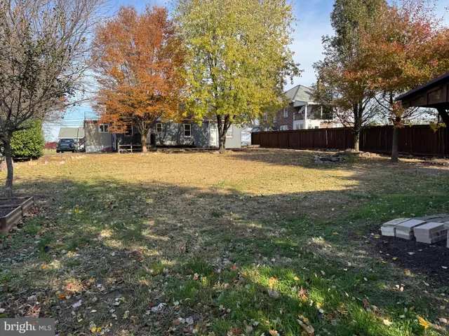 a view of outdoor space with deck and tree